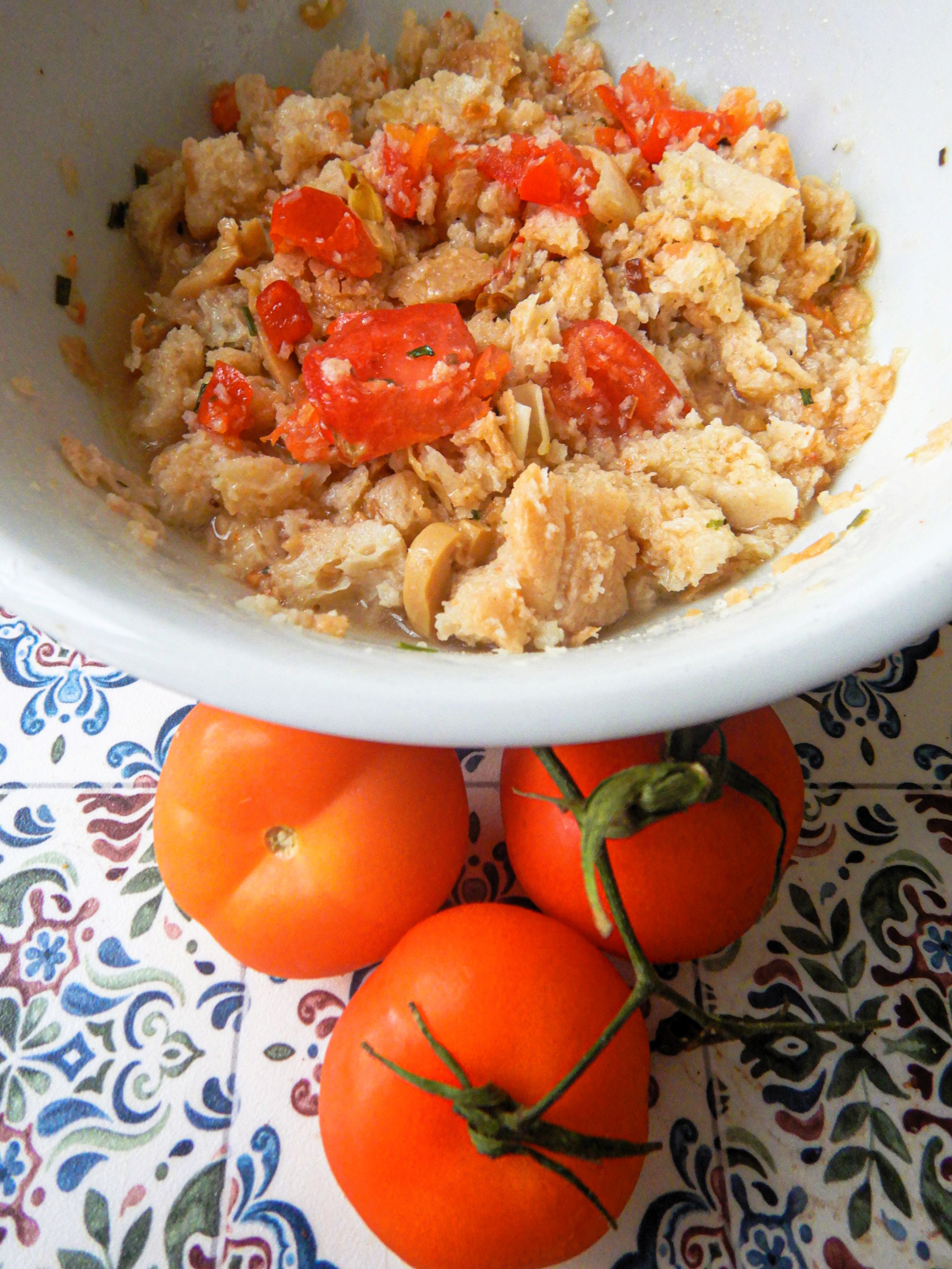 Real photograph of Italian panzanella made with stale bread, cluster tomatoes, onion and basil